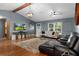 Comfortable living space with a TV, large windows, and neutral decor at 2295 Rio Cir, Spring Hill, FL 34608