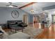 Spacious living room with hardwood floors, beamed ceilings, and stylish furnishings at 2295 Rio Cir, Spring Hill, FL 34608