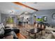 Open-concept living area with a view of the kitchen and sliding glass doors to the lanai at 2295 Rio Cir, Spring Hill, FL 34608