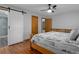 Comfortable bedroom with sliding barn door to the bathroom at 2295 Rio Cir, Spring Hill, FL 34608