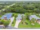 Aerial view featuring the home's location amongst verdant surroundings and neighboring homes at 2519 Shipston Ave, New Port Richey, FL 34655