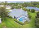 Aerial view showing screened pool and manicured lawn highlighting the property's outdoor living space at 2519 Shipston Ave, New Port Richey, FL 34655