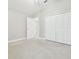 Large bedroom with neutral carpet and a closet at 2519 Shipston Ave, New Port Richey, FL 34655