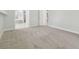 Spacious bedroom with neutral carpet and an en-suite bathroom at 2519 Shipston Ave, New Port Richey, FL 34655