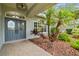 Beautiful double doors and manicured landscaping create an inviting entryway at 2519 Shipston Ave, New Port Richey, FL 34655