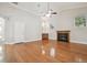 Living room with hardwood floors, vaulted ceiling, a fireplace and a small wet bar at 2519 Shipston Ave, New Port Richey, FL 34655