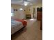Bedroom with tile flooring, a mounted TV, and access to a bathroom and rear exit door at 2870 26Th N Ave, St Petersburg, FL 33713