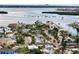 Coastal community featuring charming homes, lush landscaping, and stunning views of the bay and city skyline at 336 Boca Ciega Dr, Madeira Beach, FL 33708