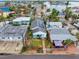 Aerial view of a home with a solar panel and a lovely canal neighborhood at 336 Boca Ciega Dr, Madeira Beach, FL 33708