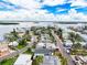 Picturesque coastal neighborhood with a mix of charming homes, palm trees, and serene waterways under a bright blue sky at 336 Boca Ciega Dr, Madeira Beach, FL 33708