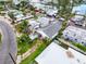 An aerial view of the property showcasing mature landscaping and surrounding neighborhood at 336 Boca Ciega Dr, Madeira Beach, FL 33708