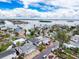 Bright coastal neighborhood with colorful homes, palm trees, and sparkling waterways under a beautiful blue sky at 336 Boca Ciega Dr, Madeira Beach, FL 33708