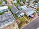 An aerial view shows houses in a waterfront residential neighborhood and a well maintained street at 336 Boca Ciega Dr, Madeira Beach, FL 33708