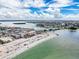 Scenic aerial view of a coastal community featuring pristine beaches and the shimmering ocean on a sunny day at 336 Boca Ciega Dr, Madeira Beach, FL 33708