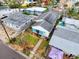 Aerial view of a cozy home with solar panels in a waterfront community at 336 Boca Ciega Dr, Madeira Beach, FL 33708