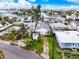 Aerial view of a home and palm-lined neighborhood near waterfront at 336 Boca Ciega Dr, Madeira Beach, FL 33708