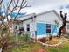 Back view of home with blue brick and white walls at 336 Boca Ciega Dr, Madeira Beach, FL 33708