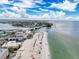 Aerial view showcasing the bridge to the beach with beautiful views of the blue ocean waters at 336 Boca Ciega Dr, Madeira Beach, FL 33708