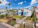 Charming home with white picket fence and a well-maintained front yard at 336 Boca Ciega Dr, Madeira Beach, FL 33708
