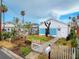 Charming home with white picket fence and a well-maintained front yard at 336 Boca Ciega Dr, Madeira Beach, FL 33708