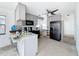 Bright kitchen featuring gray cabinets, a ceiling fan, and black appliances at 336 Boca Ciega Dr, Madeira Beach, FL 33708