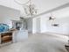 Open kitchen and living room concept featuring gray cabinets at 336 Boca Ciega Dr, Madeira Beach, FL 33708