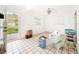 Bright living room with an open door and ceramic tiled flooring at 336 Boca Ciega Dr, Madeira Beach, FL 33708