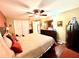 Cozy bedroom boasts ample closet space, ceiling fan, and comfortable sleeping arrangements at 3447 Paloma Dr, Holiday, FL 34690