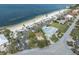 Aerial view of beachfront homes with private pools and beach access at 3701 Corsair Ct, New Port Richey, FL 34652