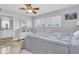Bedroom with neutral tones and a view into an attached bathroom and dresser area at 3701 Corsair Ct, New Port Richey, FL 34652