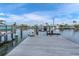 Well-maintained dock with boat lift and scenic canal views, perfect for boating enthusiasts at 3701 Corsair Ct, New Port Richey, FL 34652