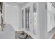 Foyer featuring decorative front door, tile floor, and closet at 3701 Corsair Ct, New Port Richey, FL 34652
