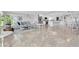 Open-concept living and dining area with modern décor and ample natural light at 3701 Corsair Ct, New Port Richey, FL 34652