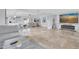 Spacious living room with an open floor plan, tile floors, and seamless water views at 3701 Corsair Ct, New Port Richey, FL 34652