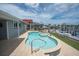 Relax by the sparkling pool and spa, offering stunning views of the canal and boat dock at 3701 Corsair Ct, New Port Richey, FL 34652