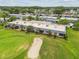 Aerial view of condos alongside a pristine golf course and sand trap at 3745 Teeside Dr # 3745, New Port Richey, FL 34655