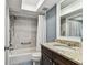 Bathroom featuring a shower and tub combination with white marble tile and a granite vanity at 3745 Teeside Dr # 3745, New Port Richey, FL 34655