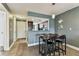 Open dining area with view to the kitchen, tiled floors, and modern decor at 3745 Teeside Dr # 3745, New Port Richey, FL 34655