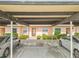 Charming single story home exterior with covered parking, manicured bushes, and neutral paint at 3745 Teeside Dr # 3745, New Port Richey, FL 34655