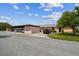 A quaint single-story home with a covered parking area, inviting curb appeal, and well-maintained landscaping at 3745 Teeside Dr # 3745, New Port Richey, FL 34655