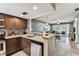 Modern kitchen open to the living area with granite countertops and stainless steel appliances at 3745 Teeside Dr # 3745, New Port Richey, FL 34655