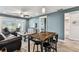 Bright living room with a dining area, ceiling fan, and a view of the lanai and backyard at 3745 Teeside Dr # 3745, New Port Richey, FL 34655