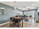 Open concept living area featuring dining space, ceiling fan, and easy access to outdoor area at 3745 Teeside Dr # 3745, New Port Richey, FL 34655