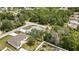 Wide aerial view of property, highlighting proximity to roads and a mix of green spaces and residences at 4360 Talco Ave, Spring Hill, FL 34609