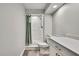 Bathroom featuring shower stall, modern vanity with stone countertop, and gray and green curtains at 4360 Talco Ave, Spring Hill, FL 34609