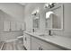 This contemporary bathroom offers dual sinks, vanities, modern lighting, and shower at 4360 Talco Ave, Spring Hill, FL 34609