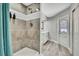 Bathroom featuring tiled shower and door to hallway at 4360 Talco Ave, Spring Hill, FL 34609