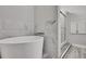 Beautiful bathroom features a soaking tub and walk-in shower with stylish marble and wood accents at 4360 Talco Ave, Spring Hill, FL 34609