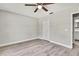 Bedroom featuring ceiling fan and door to bath at 4360 Talco Ave, Spring Hill, FL 34609