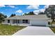 Inviting single-story home with a spacious driveway and a neatly manicured front lawn at 4360 Talco Ave, Spring Hill, FL 34609